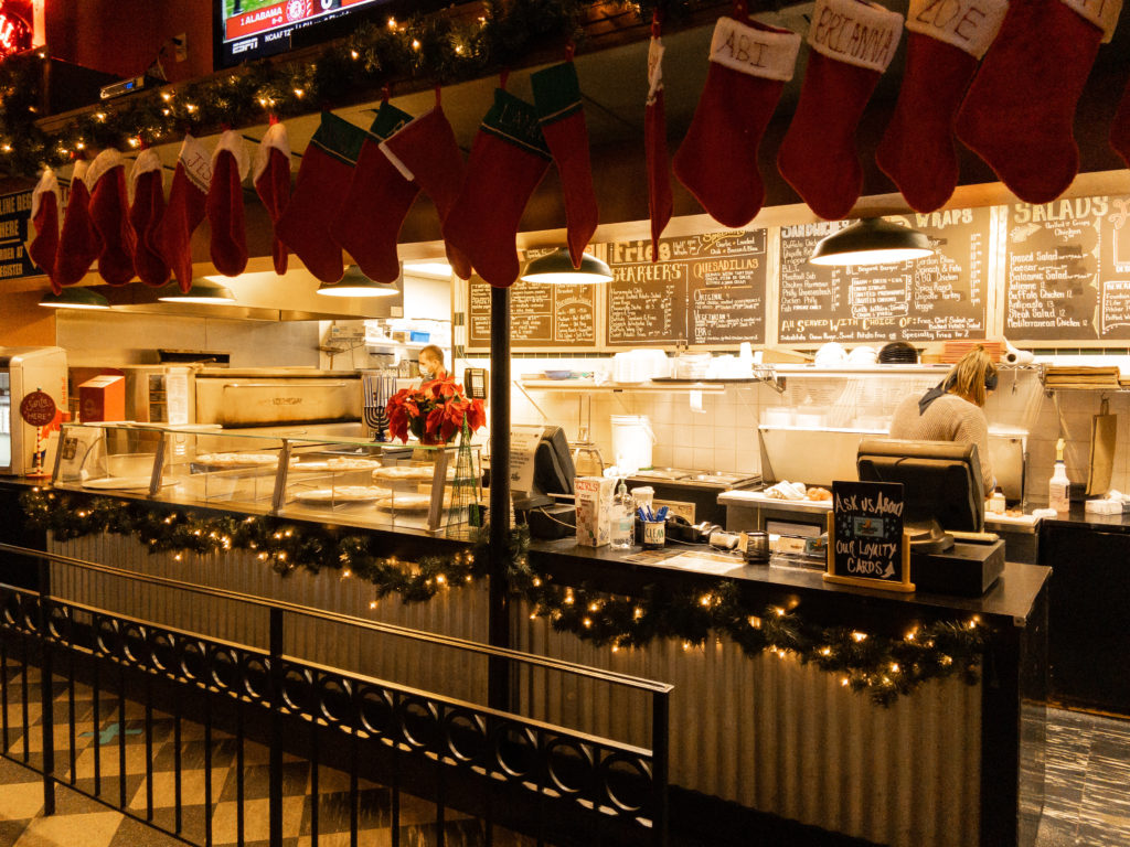 Christmas decor at the pizza counter for Trapper's holiday month.