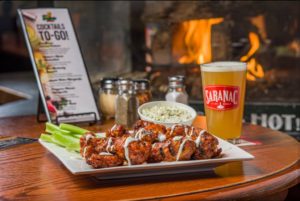 Trapper's Pizza Pub chicken wings with homemade bleu cheese and a beer